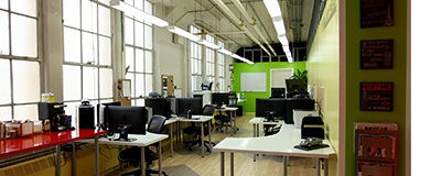 VaporPlants office inside shown with computers and tables