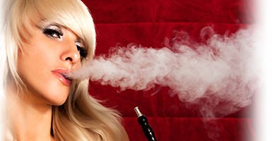 hookah being exhaled by a pretty model on a red background