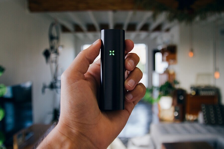 Pax vaporizer in a mans hand