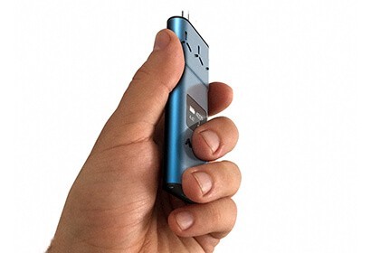 AirVape XS Weed Wax Vaporizer in blue held in a mans hand