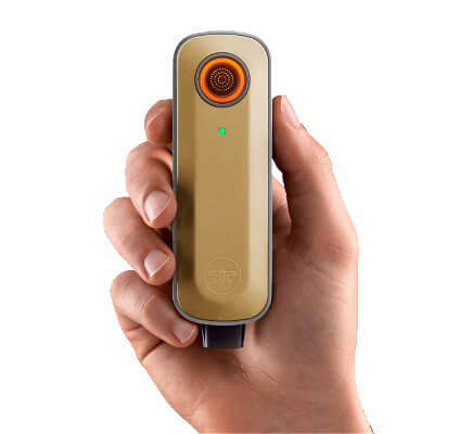 Firefly 2 vaporizer for dry herbs held in a hand