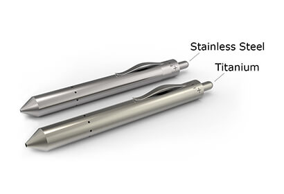 Grasshopper vape pen shown next to titanium and stainless steel