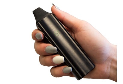 a female hand holding VaporFi Atom vaporizer