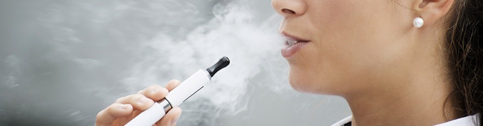 female is vaping using a vaporizer