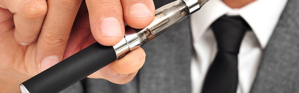 Man's Hand holding a Vape Pen