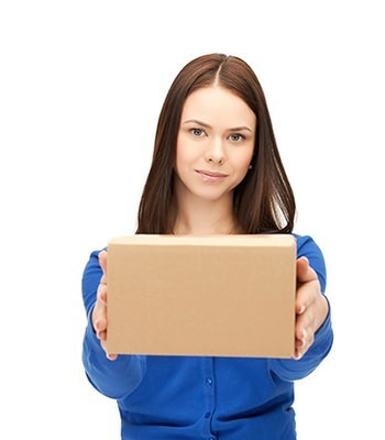 Young female in blue shirt is holding a packaging box