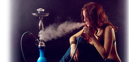 water pipe hookah being smoked by a girl